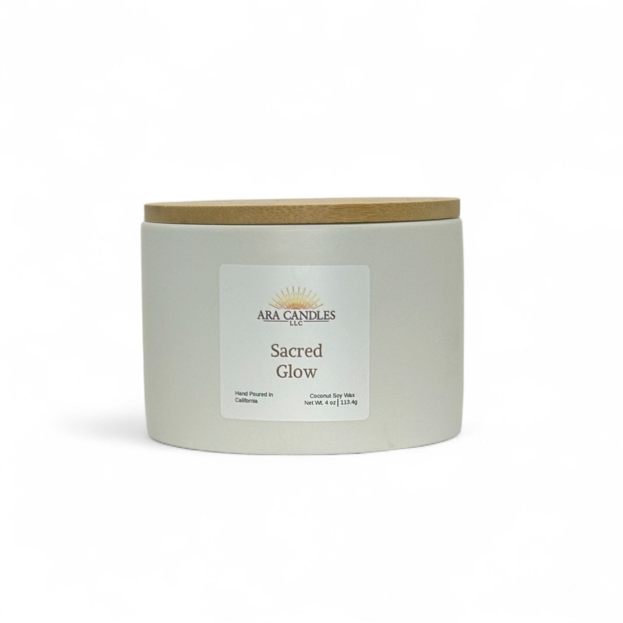 Sacred Glow candle from ARA Candles, minimalist white vessel with grounding palo santo and grapefruit scent.