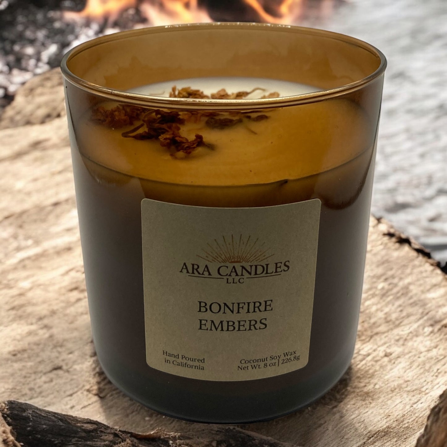 Bonfire Embers flameless 8 oz candle in an amber jar, offering a warm, cozy scent of smoky bonfire embers, perfect for creating a comforting, flame-free ambiance