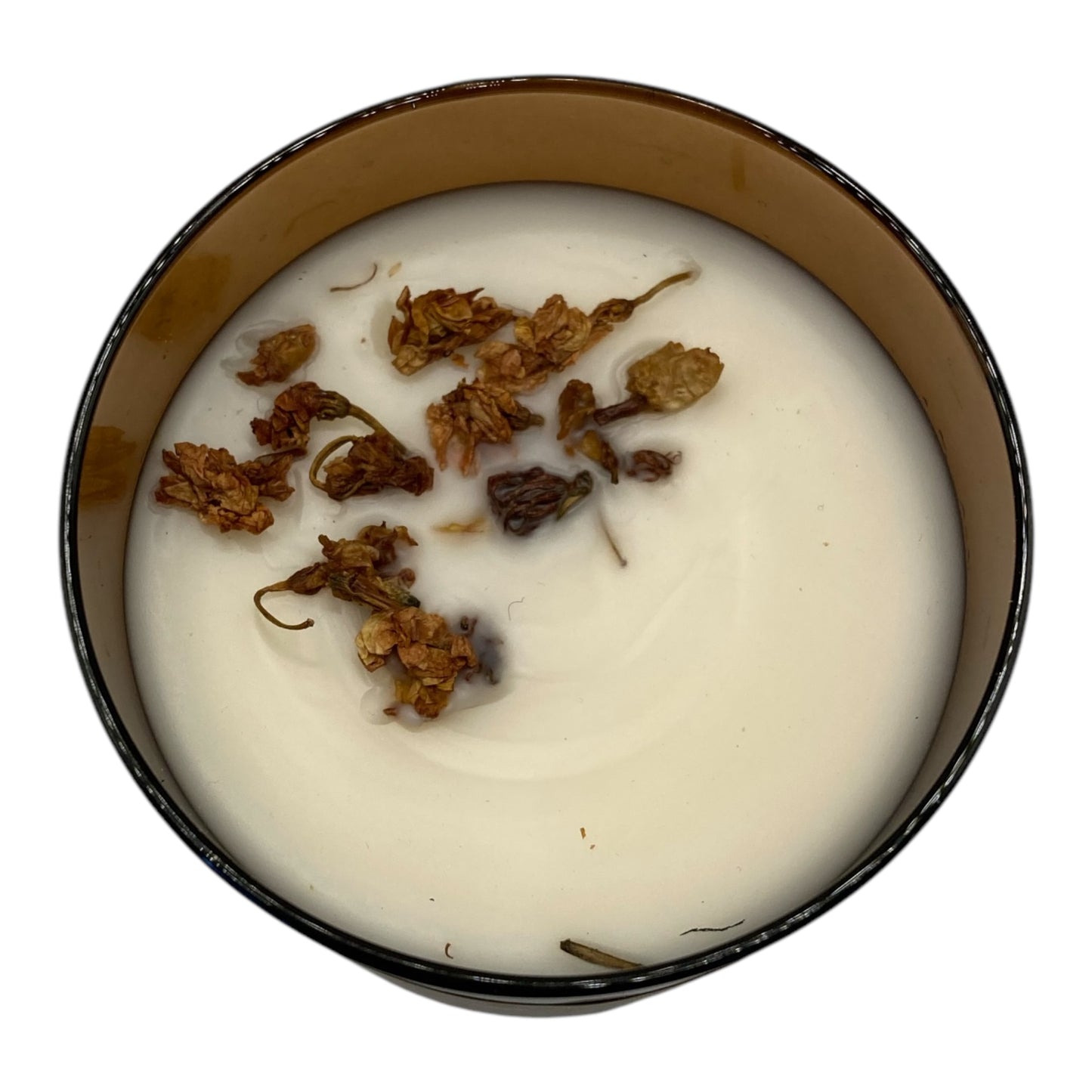 Top view of Bonfire Embers flameless 8 oz candle in an amber jar with dried leaves on top of the wax, offering a warm, smoky bonfire fragrance for a cozy, flame-free ambiance
