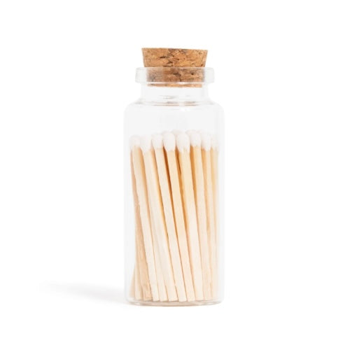 Glass vial of natural white-tipped matches with cork lid for intentional rituals and candle lighting