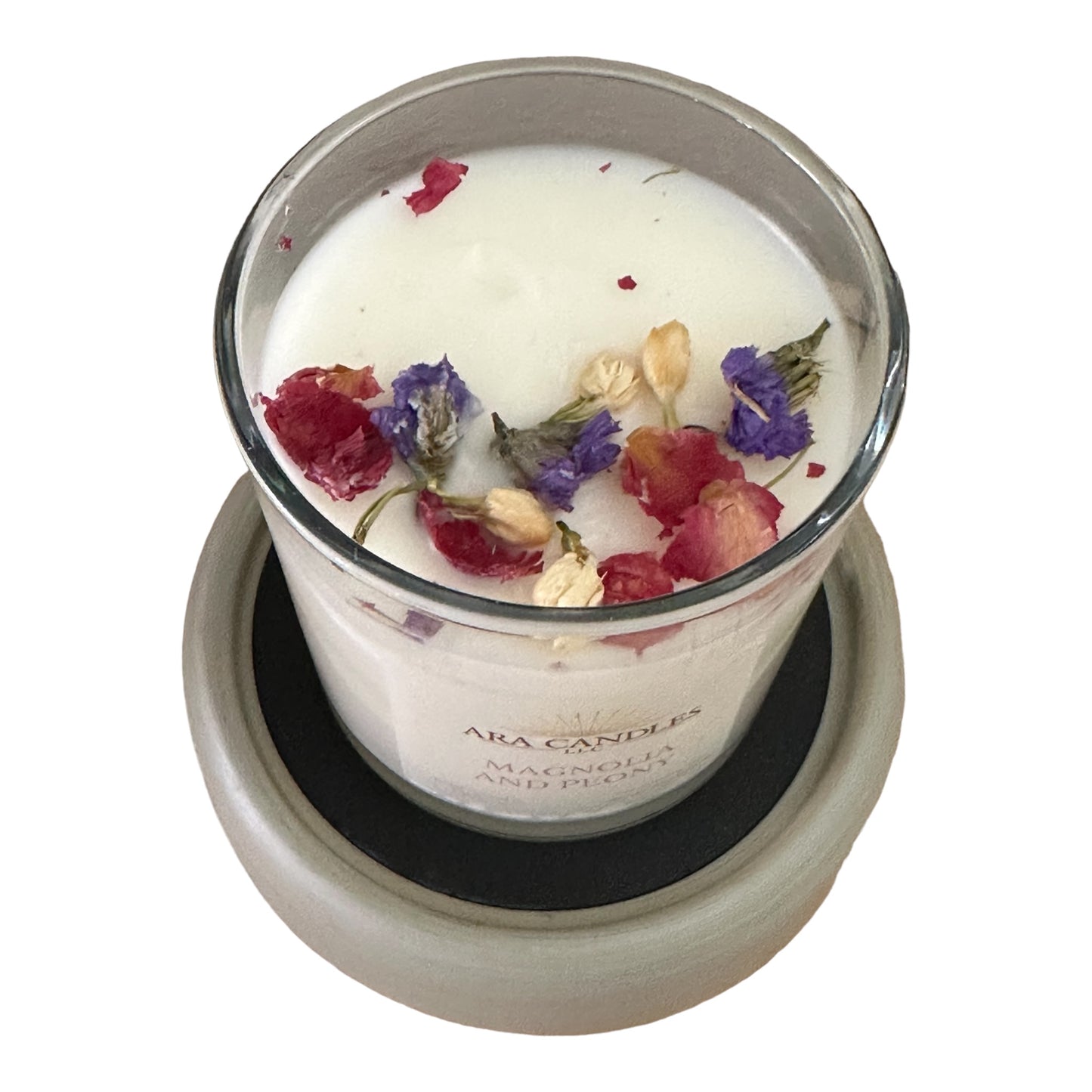 Top view of Magnolia and Peony flameless 8 oz candle on a wax warmer, set against a clean white background, offering a calming floral fragrance in a flame-free form