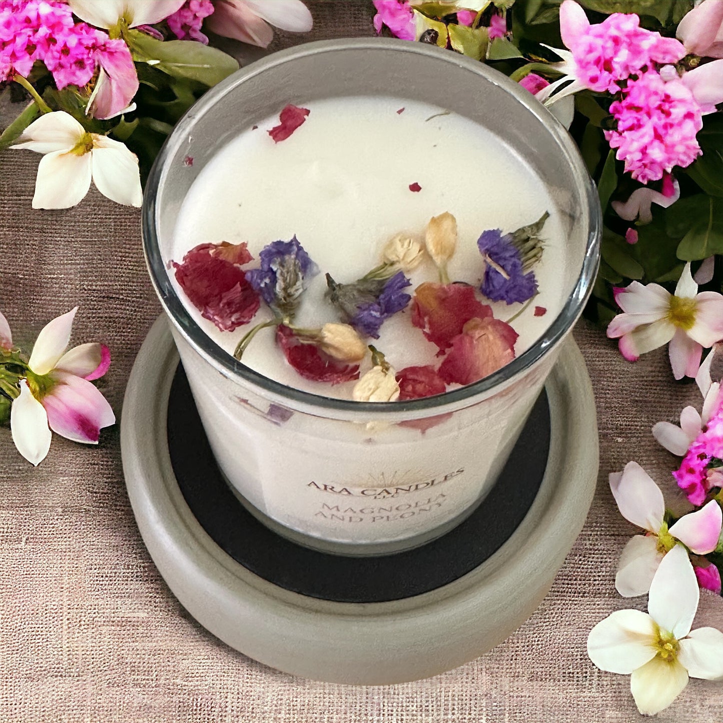 Top view of Magnolia and Peony flameless 8 oz candle on a wax warmer, offering a soothing floral scent and creating a cozy, flame-free ambiance