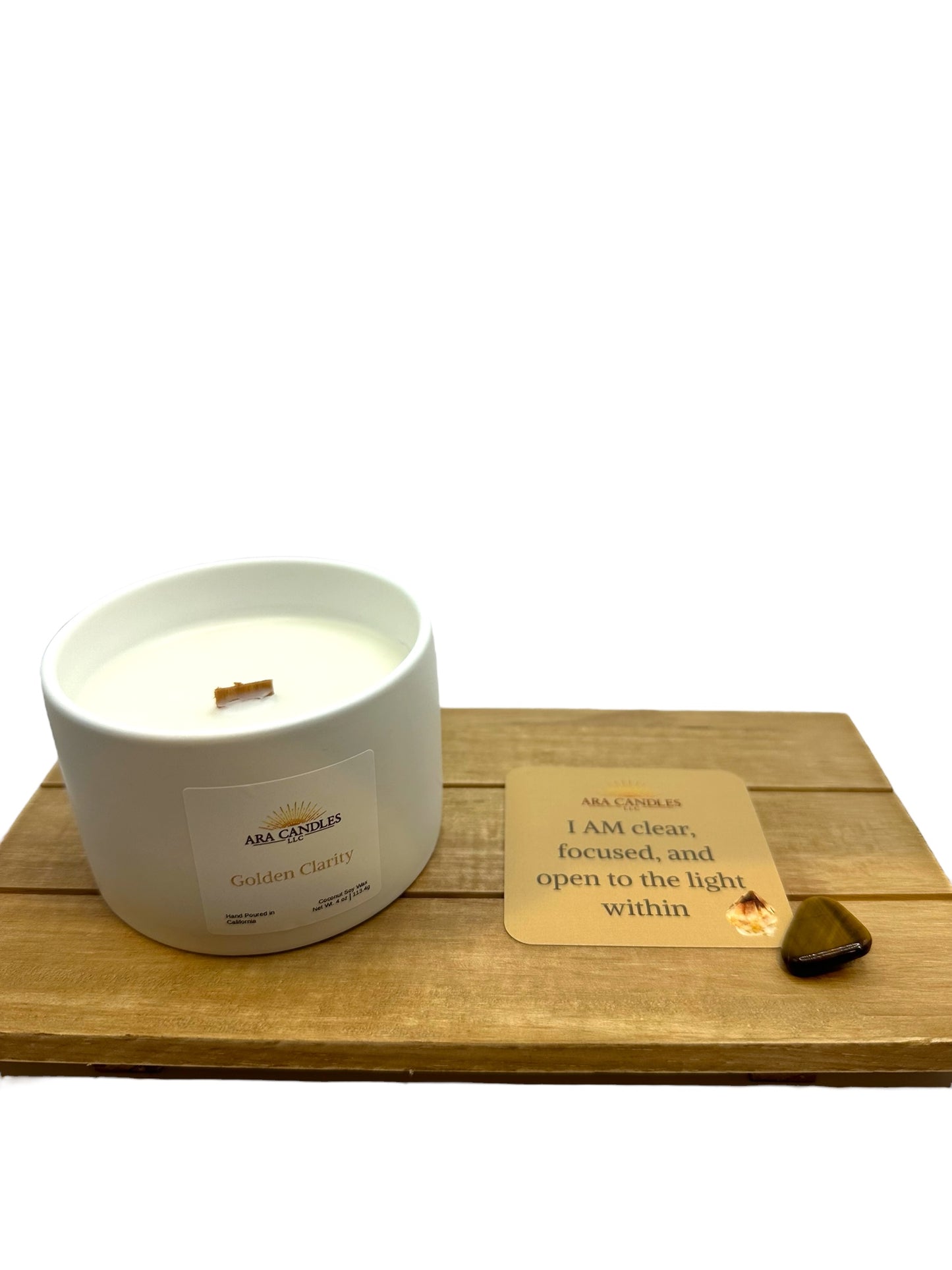 Golden Clarity coconut soy candle with affirmation card and Tiger’s Eye stone on a wooden tray for a focused mindfulness ritual.