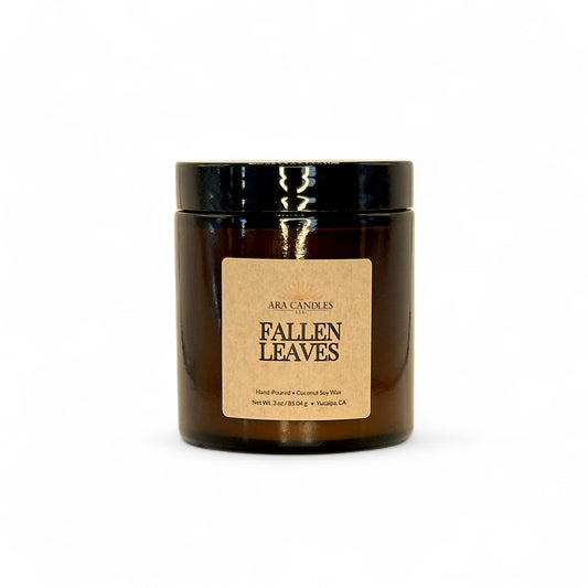 Ara Candles 'Fallen Leaves' candle in a brown jar on a white background