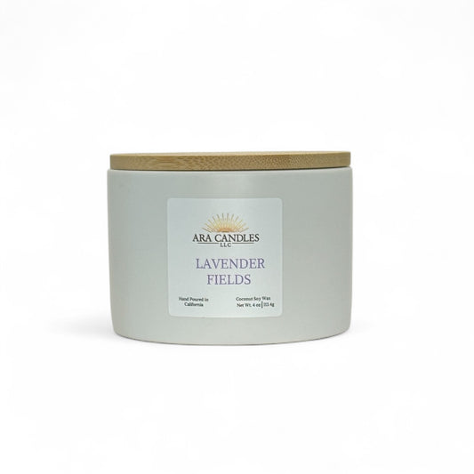 Lavender fields candle by ARA candles, in matte ceramic container with lavender label and bamboo lid.