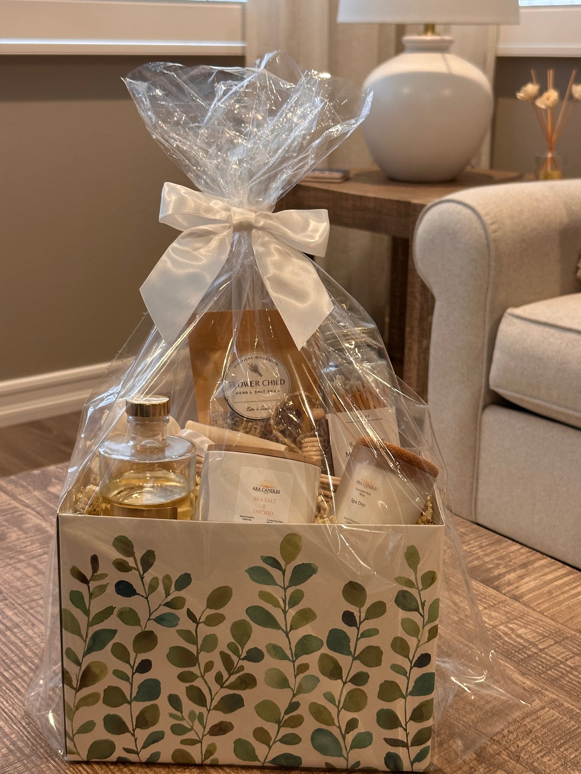 Housewarming Wellness Basket with scented candles, reed diffusers, and bath salts for relaxation