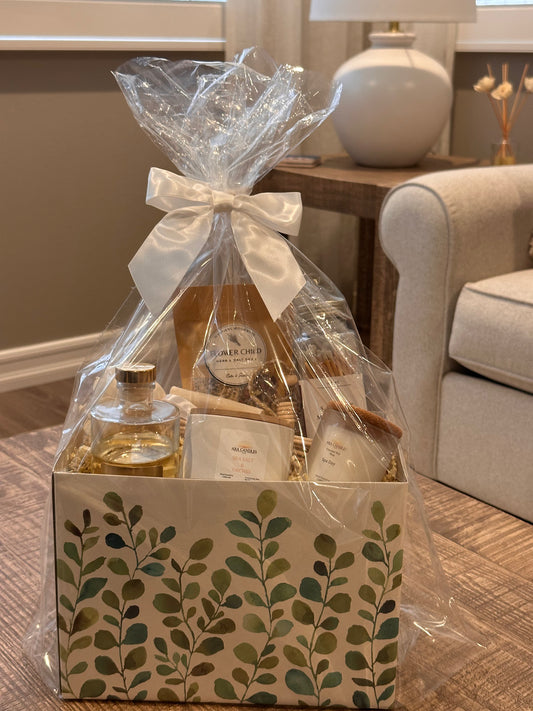 Housewarming Wellness Basket with scented candles, reed diffusers, and bath salts for relaxation