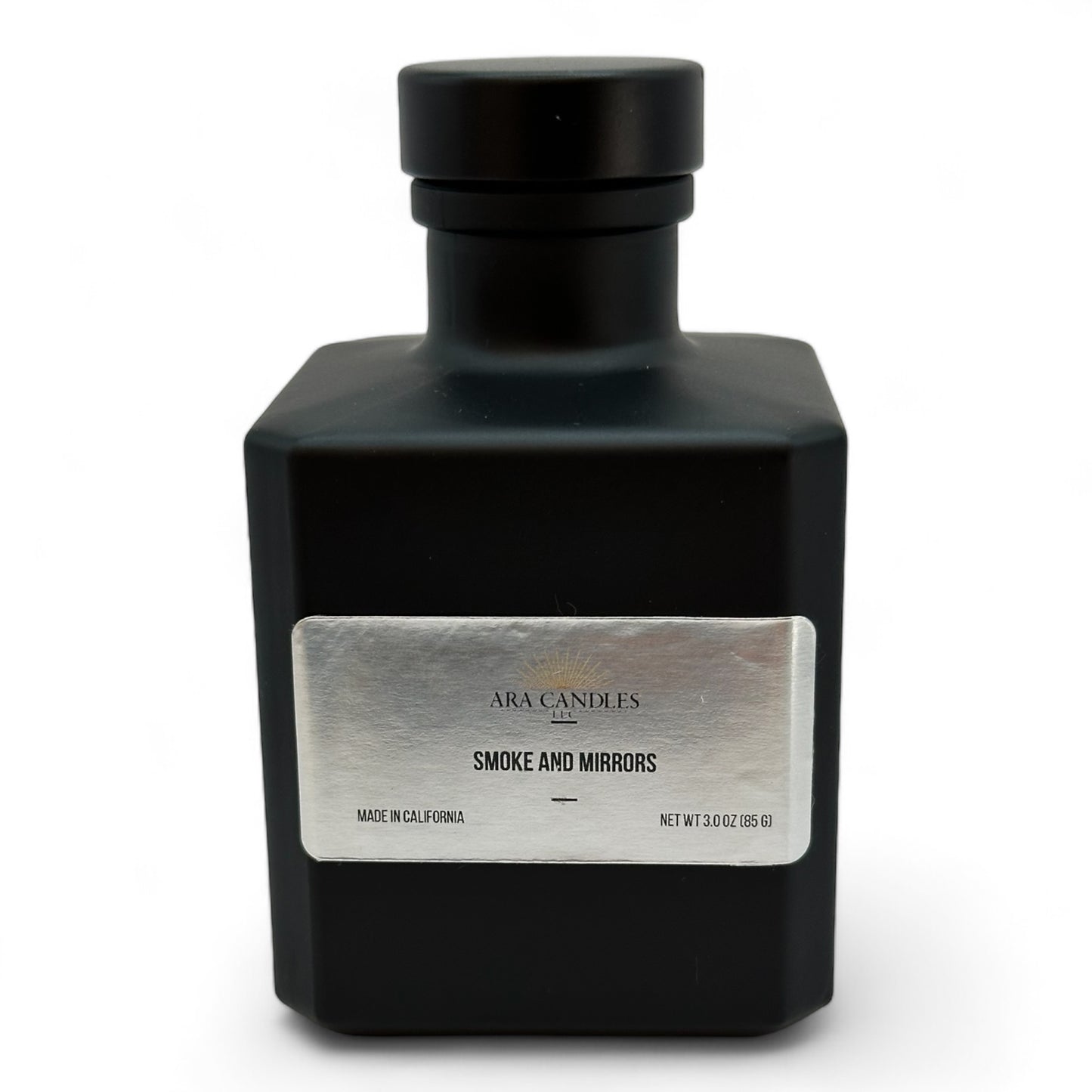 Smoke and Mirrors reed diffuser, offering a captivating and mysterious fragrance blend that creates an elegant and soothing atmosphere in any room.