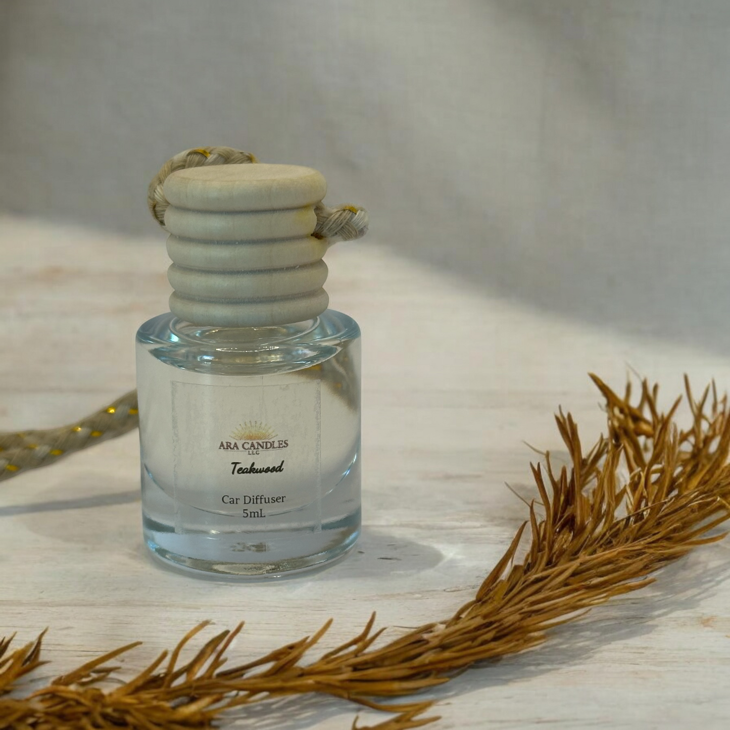 Teakwood car diffuser with a rich, woody fragrance that brings a warm and earthy aroma to your vehicle