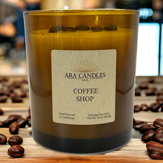 Coffee Shop flameless 8 oz candle surrounded by coffee beans, creating a warm, aromatic coffee ambiance without the flame