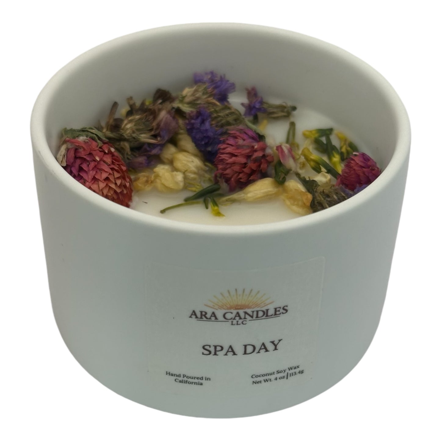 Front view of Day at the Spa flameless 4 oz candle with dried roses on top, providing a relaxing atmosphere and a charming, decorative element