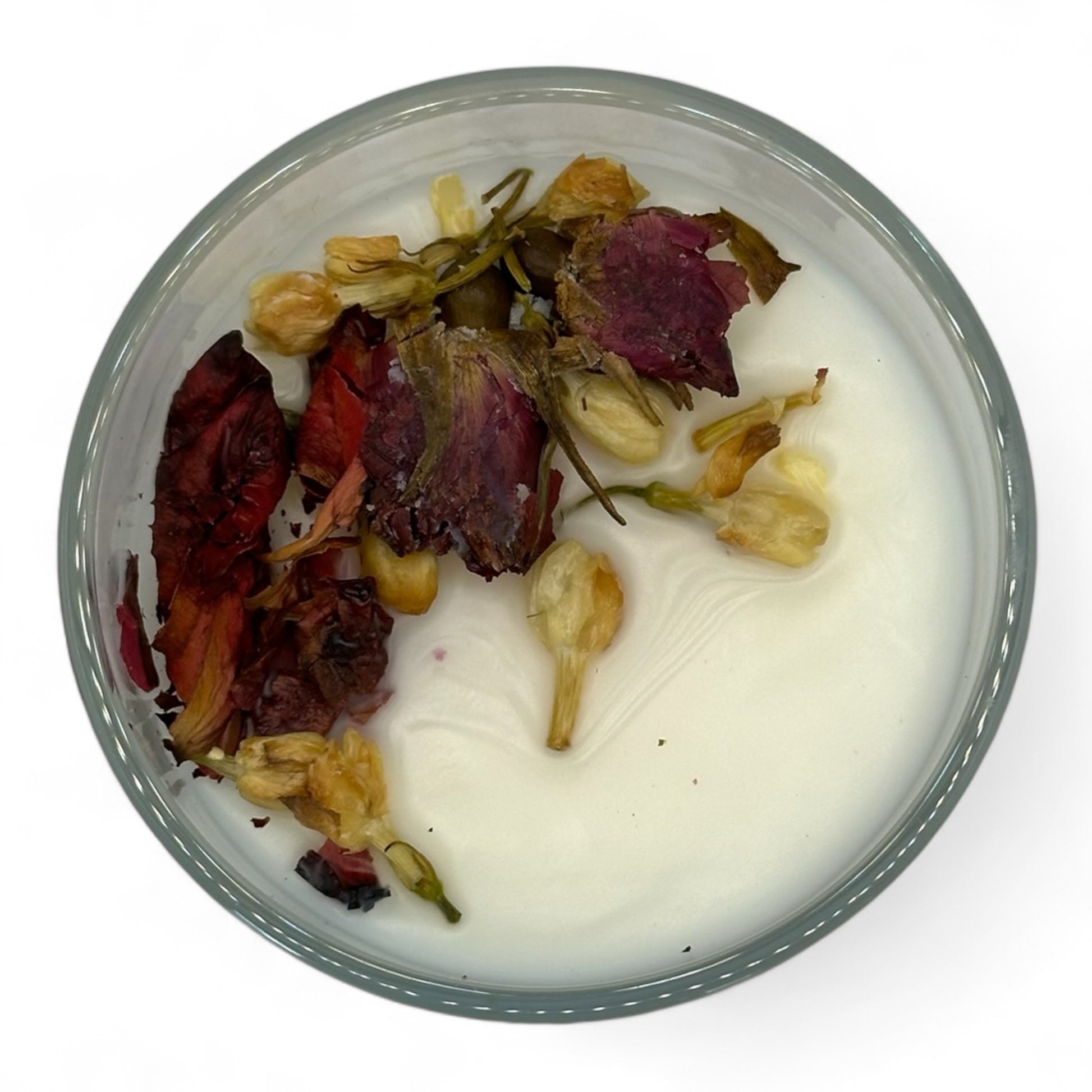 Top view of Day at the Spa flameless 8 oz candle with dried roses on top, adding a delicate touch to the soothing spa-inspired fragrance