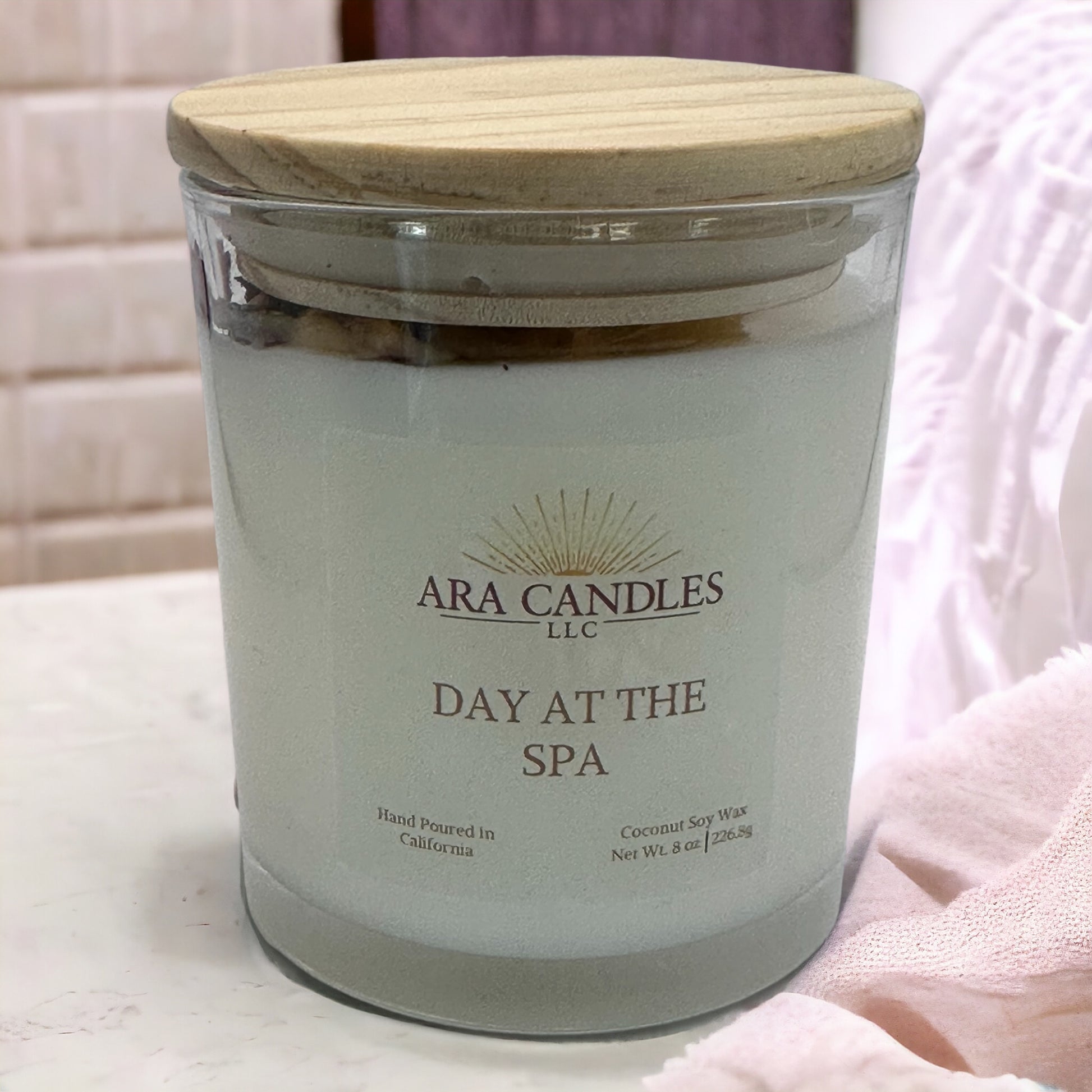 Day at the Spa flameless 8 oz candle surrounded by a serene spa setting, offering a soothing fragrance to create a calming, flame-free atmosphere