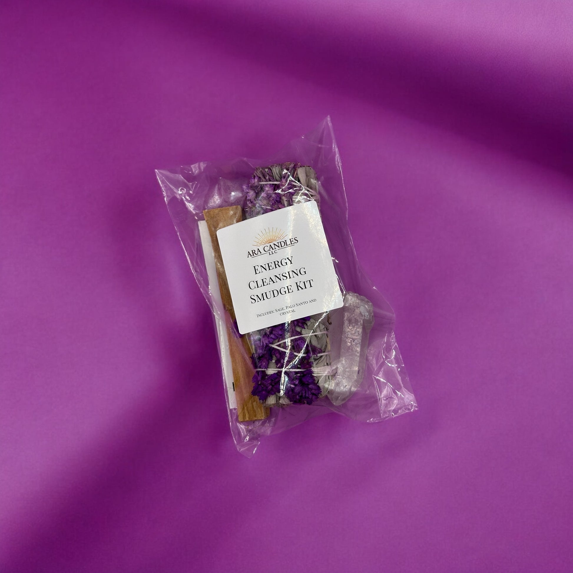 Energy Cleansing Smudge Kit including sage, palo santo, and other tools for purifying and balancing energy in your space