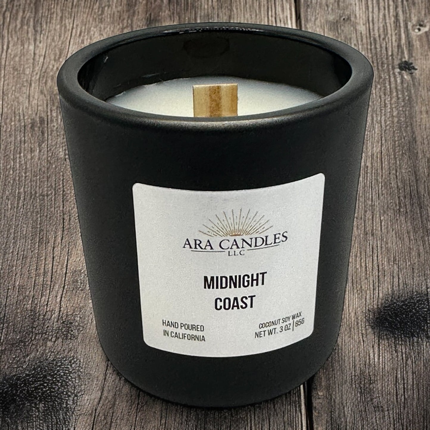 Midnight Coast 3 oz coconut soy candle, set against a grey wooden background, offering a refreshing coastal fragrance in eco-friendly coconut soy wax