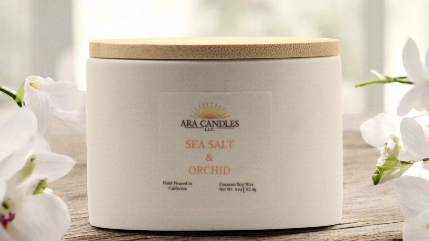 Sea salt and orchid scented candle with a fresh, floral fragrance that creates a calming and luxurious ambiance in any room